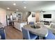Bright and open kitchen flowing into the dining and living area with a spacious island at 31888 Treasure Dock Isle, Wesley Chapel, FL 33545