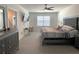 Serene main bedroom showcasing a plush bed, a mounted TV, and lots of natural light at 31888 Treasure Dock Isle, Wesley Chapel, FL 33545