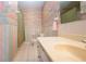 Bathroom featuring a vanity, toilet, and shower with green curtains at 322 Club Manor Dr, Sun City Center, FL 33573