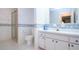 Bathroom featuring a glass shower, vanity, and toilet with floral wallpaper at 322 Club Manor Dr, Sun City Center, FL 33573