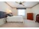 Cozy bedroom featuring a ceiling fan and large window at 322 Club Manor Dr, Sun City Center, FL 33573