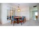 Dining room with modern lighting fixture and decor at 322 Club Manor Dr, Sun City Center, FL 33573