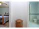 Hallway between the bedroom and the bathroom featuring a small storage basket on the floor at 322 Club Manor Dr, Sun City Center, FL 33573