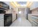 Well-lit kitchen with modern appliances and sleek countertops at 322 Club Manor Dr, Sun City Center, FL 33573