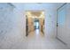 Bright kitchen featuring tile flooring, stainless steel refrigerator and open access to the living area at 322 Club Manor Dr, Sun City Center, FL 33573