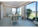 Enclosed lanai featuring outdoor seating with a beautiful view of the community landscape at 322 Club Manor Dr, Sun City Center, FL 33573