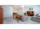 Spacious living room area featuring a sofa, and view into the dining room at 322 Club Manor Dr, Sun City Center, FL 33573