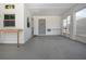 Sun room features a concrete floor, and white walls plus multiple windows at 322 Club Manor Dr, Sun City Center, FL 33573