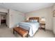 Serene bedroom with a queen bed, woven accents, neutral walls, and carpeted floors for a restful retreat at 4766 Snook Se Dr, St Petersburg, FL 33705