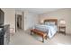 Spacious bedroom features a queen bed, woven furniture, carpeted floors, and ample closet space for comfortable living at 4766 Snook Se Dr, St Petersburg, FL 33705