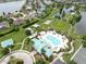 Aerial view showcasing community amenities: pool, playground, and lakes. Perfect for recreation at 5324 Moon Shell Dr, Apollo Beach, FL 33572