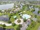 Aerial view of a community featuring scenic ponds, green spaces, pool, and recreational areas at 5324 Moon Shell Dr, Apollo Beach, FL 33572