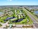 Breathtaking aerial view of the community: lakes, pool, highways, and recreational facilities at 5324 Moon Shell Dr, Apollo Beach, FL 33572