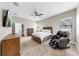 Cozy bedroom features a comfortable bed, modern furniture, and a ceiling fan for a relaxing atmosphere at 5324 Moon Shell Dr, Apollo Beach, FL 33572