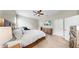 Spacious bedroom featuring a large bed, dresser, a flatscreen TV, and neutral tones providing a relaxing atmosphere at 5324 Moon Shell Dr, Apollo Beach, FL 33572