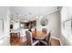Dining area has a wooden table and decorative mirror on the wall, next to the kitchen at 5324 Moon Shell Dr, Apollo Beach, FL 33572