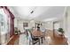 Formal dining room showcasing hardwood floors and chandelier with ample natural light at 5324 Moon Shell Dr, Apollo Beach, FL 33572