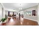 Open-concept space featuring a dining area, living room, and stylish dark wood flooring at 5324 Moon Shell Dr, Apollo Beach, FL 33572