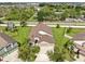Beautiful exterior view with stone facade, well-manicured lawn, and a three-car garage at 5324 Moon Shell Dr, Apollo Beach, FL 33572