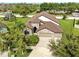 Lovely home with stone accents, arched entryway, and a spacious three-car garage at 5324 Moon Shell Dr, Apollo Beach, FL 33572