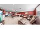 Spacious game room with a pool table, comfortable seating, and a beverage station at 5324 Moon Shell Dr, Apollo Beach, FL 33572