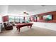 Game room with pool table, comfortable seating area, and a view of the window at 5324 Moon Shell Dr, Apollo Beach, FL 33572