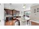 Modern kitchen featuring stainless steel appliances, granite countertops, and wood flooring at 5324 Moon Shell Dr, Apollo Beach, FL 33572