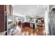 Open kitchen and living area with stainless steel appliances and beautiful hardwood floors at 5324 Moon Shell Dr, Apollo Beach, FL 33572