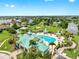 Aerial view showcases the community pool, amenity center, and surrounding lush landscape at 5324 Moon Shell Dr, Apollo Beach, FL 33572