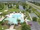 Beautiful community pool, playground, and recreation area surrounded by tropical landscaping at 5324 Moon Shell Dr, Apollo Beach, FL 33572