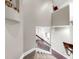 Carpeted staircase with decorative iron railing and views to the foyer and living room at 5324 Moon Shell Dr, Apollo Beach, FL 33572