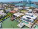 Stunning waterfront property with pool, boat dock, and views of the bay in a coastal community at 540 59Th Ave, St Pete Beach, FL 33706