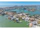 Aerial view of a waterfront community with stunning turquoise waters and luxurious homes and canals at 540 59Th Ave, St Pete Beach, FL 33706