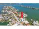 Aerial view of the home, canal, and the surrounding neighborhood at 540 59Th Ave, St Pete Beach, FL 33706