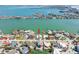 Stunning aerial view showcases the waterfront home's prime location, private dock, and proximity to the bay at 540 59Th Ave, St Pete Beach, FL 33706