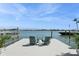 Scenic view from the private dock, featuring comfortable seating and stunning waterfront scenery under a bright sky at 540 59Th Ave, St Pete Beach, FL 33706