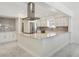 Modern kitchen with stainless steel appliances, marble countertops, and an oversized range hood at 540 59Th Ave, St Pete Beach, FL 33706
