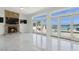 Bright living room with fireplace, water views, and access to the pool at 540 59Th Ave, St Pete Beach, FL 33706