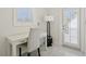 Bright office space features a modern desk, chair, and large window, perfect for remote work at 540 59Th Ave, St Pete Beach, FL 33706