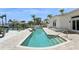 An inviting rectangular pool with brickwork and tropical palms overlooks waterfront dockage at 540 59Th Ave, St Pete Beach, FL 33706