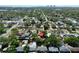 High aerial view showcasing the house nestled among mature trees in a established neighborhood at 619 41St Ne Ave, St Petersburg, FL 33703