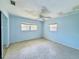 Bedroom with blue walls, ceiling fan, and two windows for ample lighting at 619 41St Ne Ave, St Petersburg, FL 33703