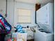 Small laundry room with washer, dryer, sink, and window at 619 41St Ne Ave, St Petersburg, FL 33703