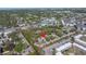 Aerial shot of property with red arrow, showcasing location within a leafy residential neighborhood at 7016 2Nd N St, St Petersburg, FL 33702