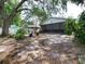 Spacious backyard featuring a screened lanai and mature trees at 7016 2Nd N St, St Petersburg, FL 33702