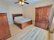 Comfortable bedroom featuring wooden furniture, ceiling fan and light wood floors at 7016 2Nd N St, St Petersburg, FL 33702