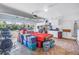 Spacious garage featuring an open garage door, utility area with cabinets, and ample storage space at 7016 2Nd N St, St Petersburg, FL 33702
