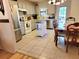 Bright eat-in kitchen boasts stainless steel appliances, an island and tile flooring at 7016 2Nd N St, St Petersburg, FL 33702