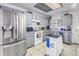 Bright kitchen featuring modern stainless steel appliances, tile flooring, and ample cabinet space at 7016 2Nd N St, St Petersburg, FL 33702