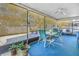 Covered patio area with ceiling fan and dining table at 7016 2Nd N St, St Petersburg, FL 33702
